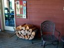 Woodrack on porch.